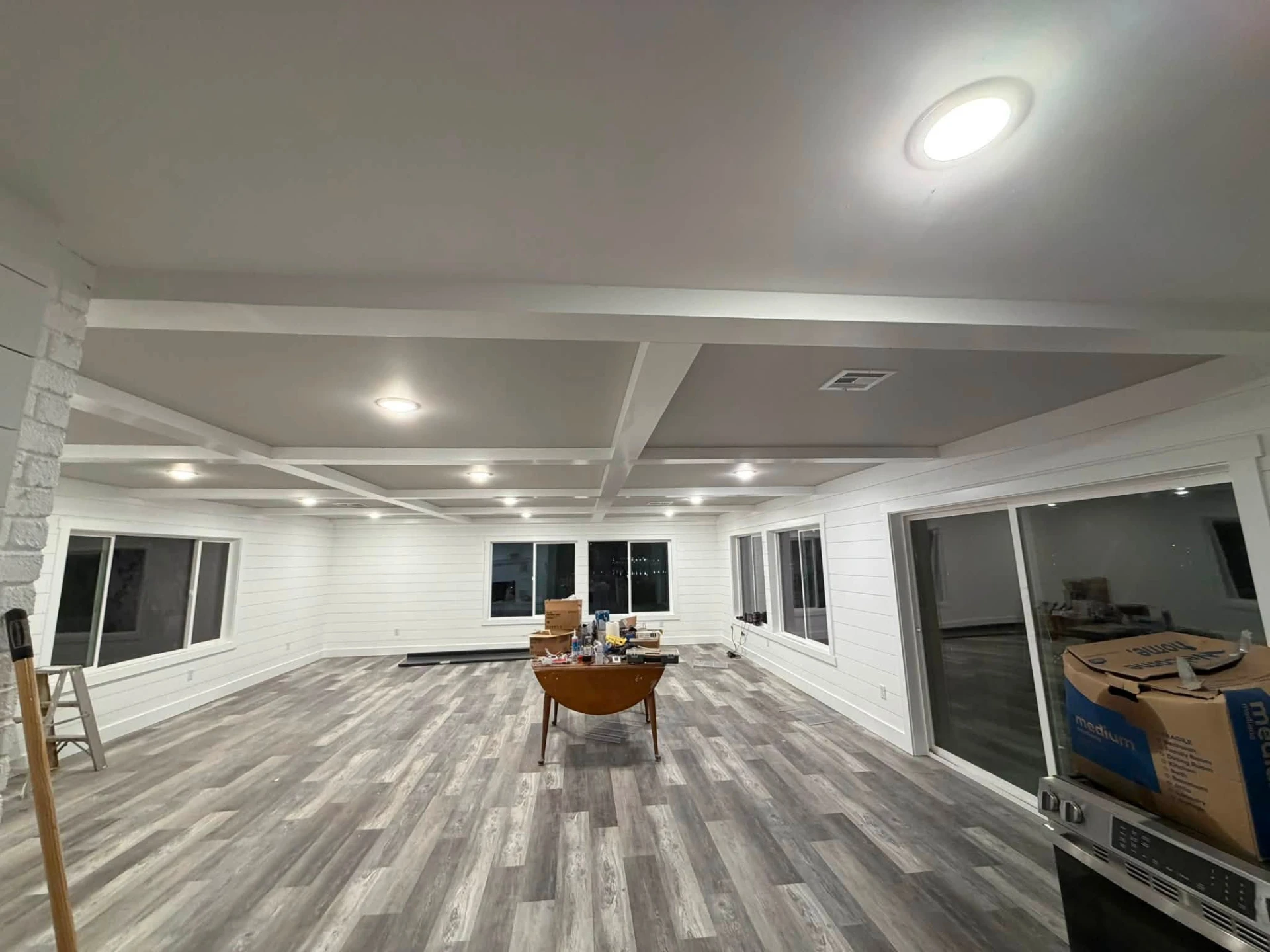 Custom coffered ceiling and shiplap interior by Puntos Carpentry
